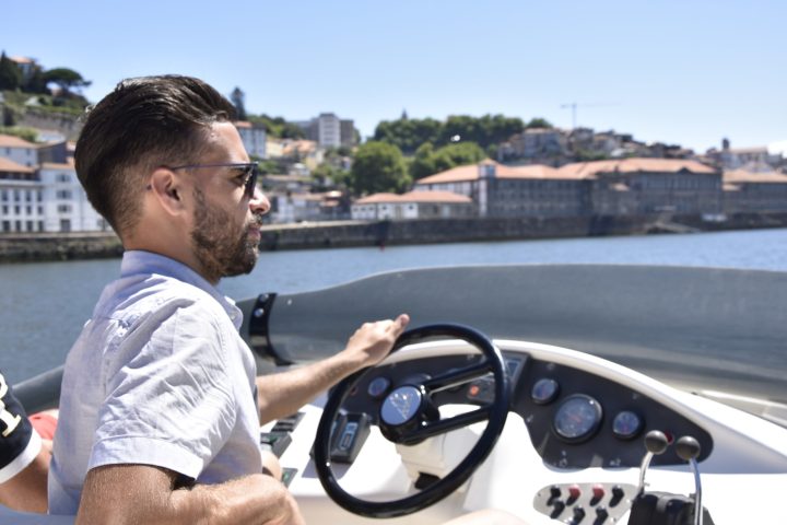 a man sitting in a parking lot