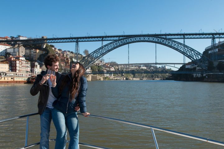 a person crossing a bridge over a body of water