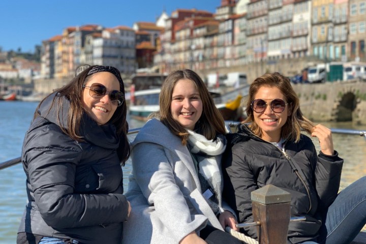 a couple of people that are sitting in the middle of a city