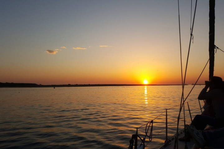 a sunset over a body of water
