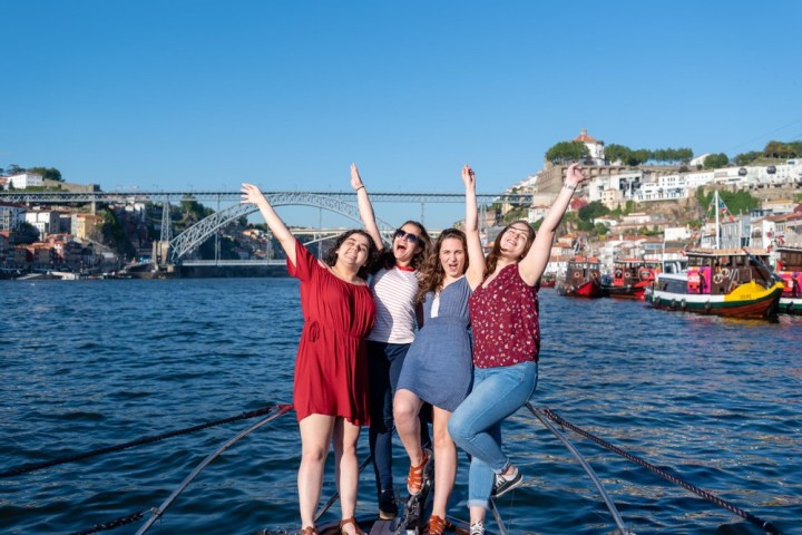 a person standing next to a body of water