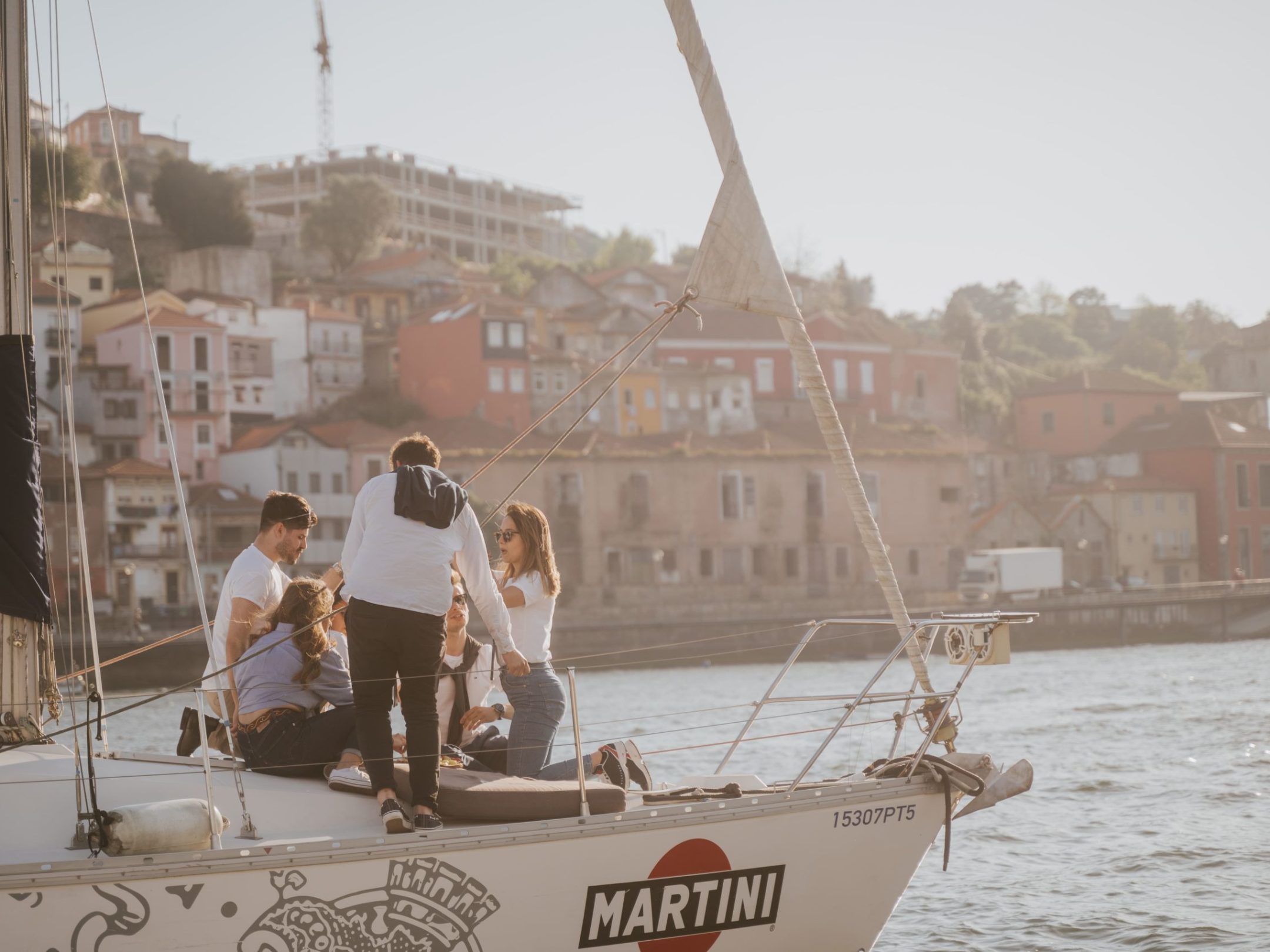 a man standing in front of a large ship in the water