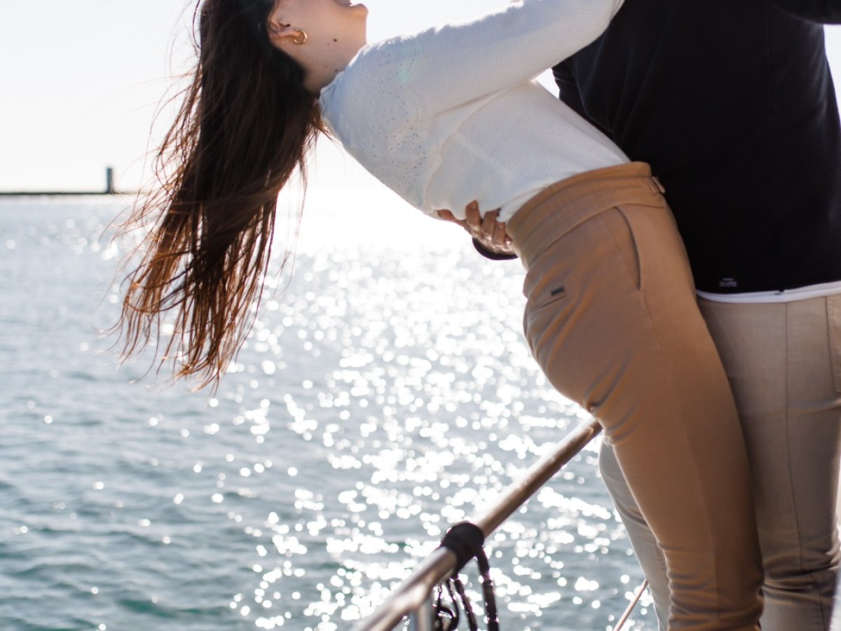 a person standing next to a body of water