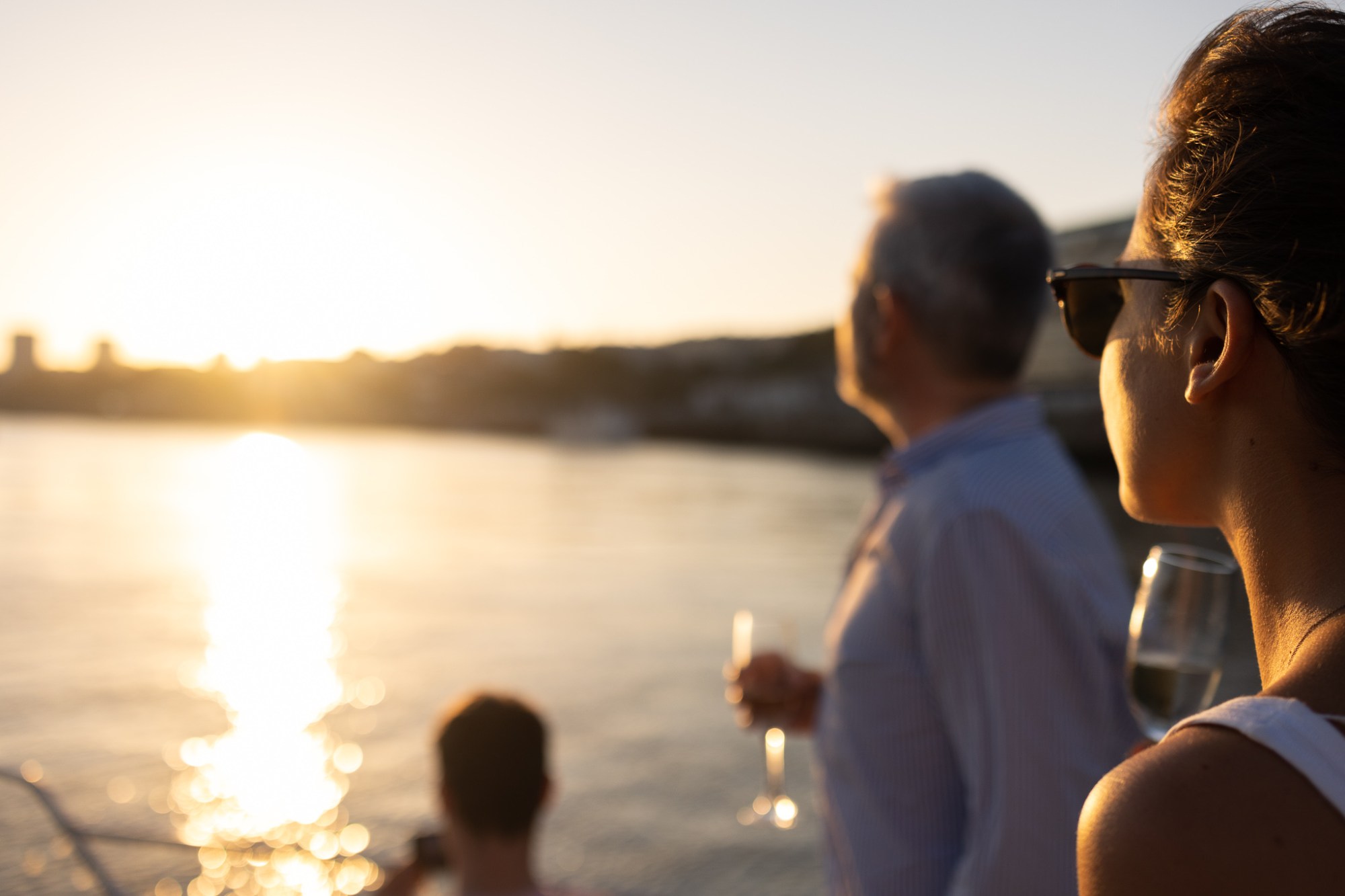 a man holding a glass of water