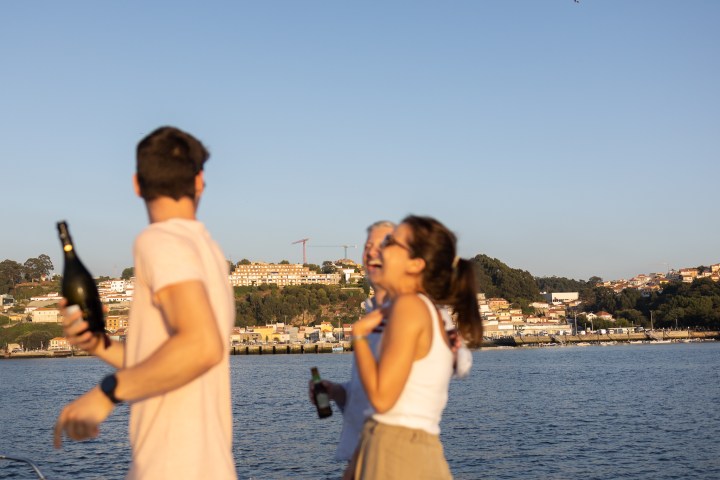 a person standing next to a body of water