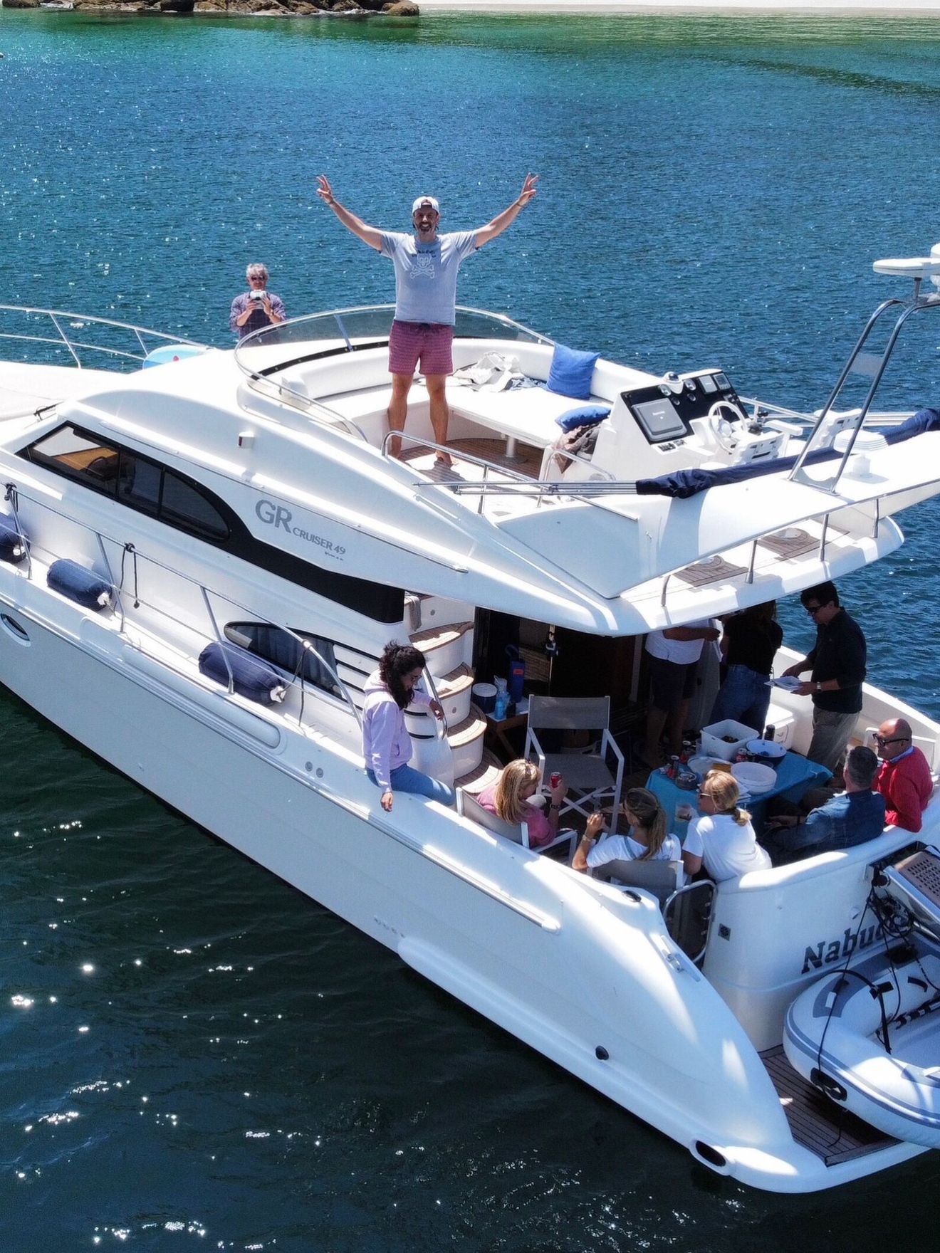 a group of people on a boat in a large body of water