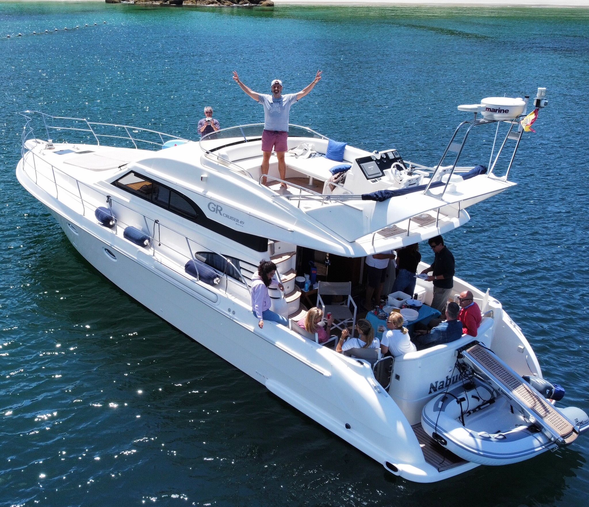 a group of people on a boat in a large body of water