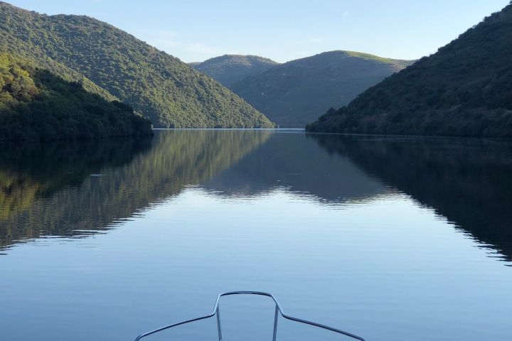 a body of water with a mountain in the background