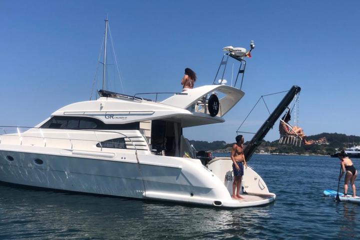 a group of people on a boat in a large body of water