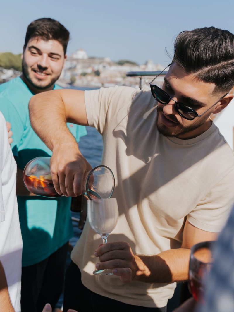 a group of people looking at a cell phone