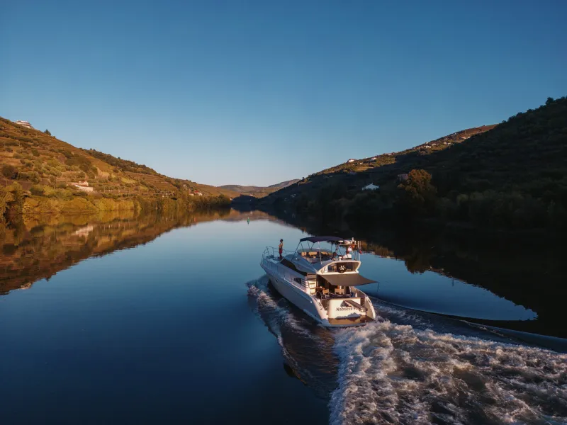 a large body of water with a mountain in the background