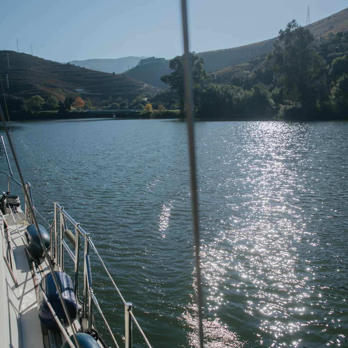 a boat is docked next to a body of water