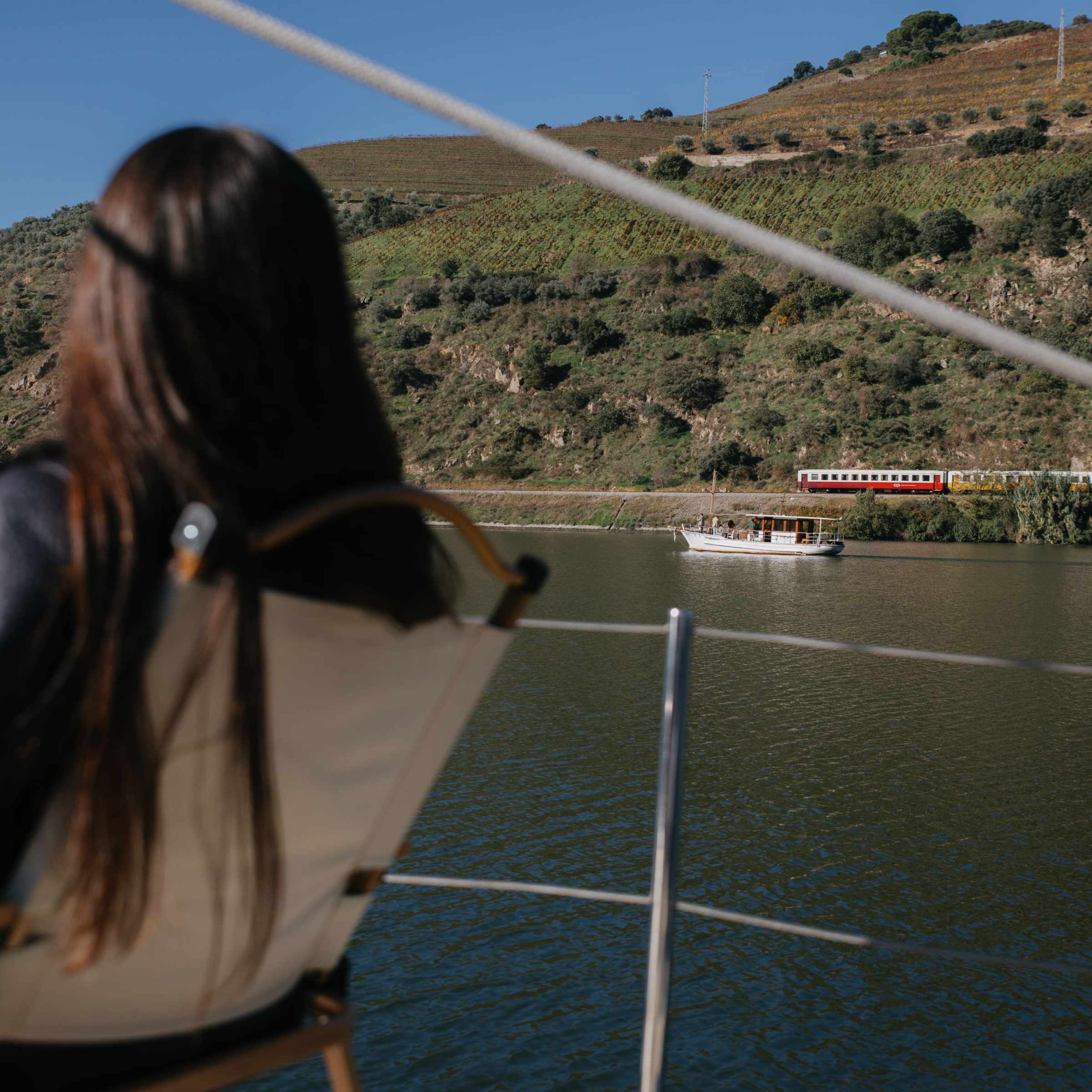 a person standing in front of a body of water