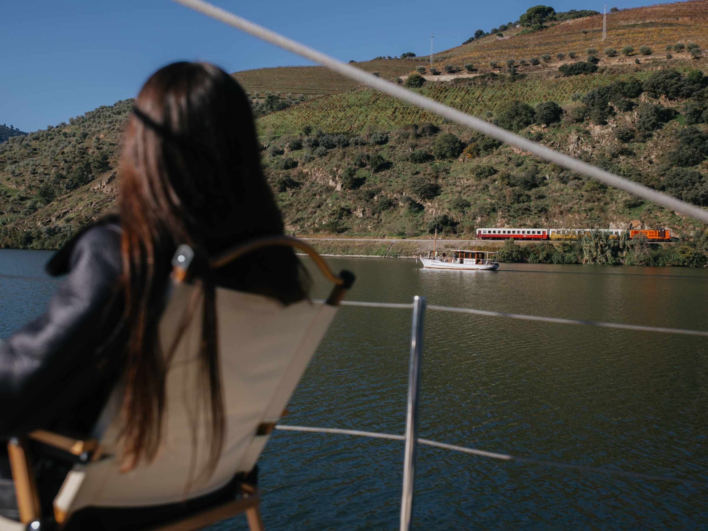a person standing in front of a body of water